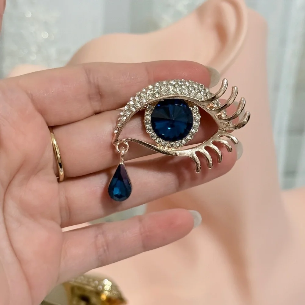 Elegant Blue and Gold Eye Brooch